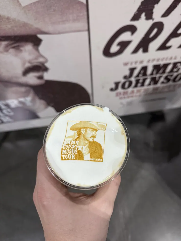 Logo latte art printed in the foam of a drink