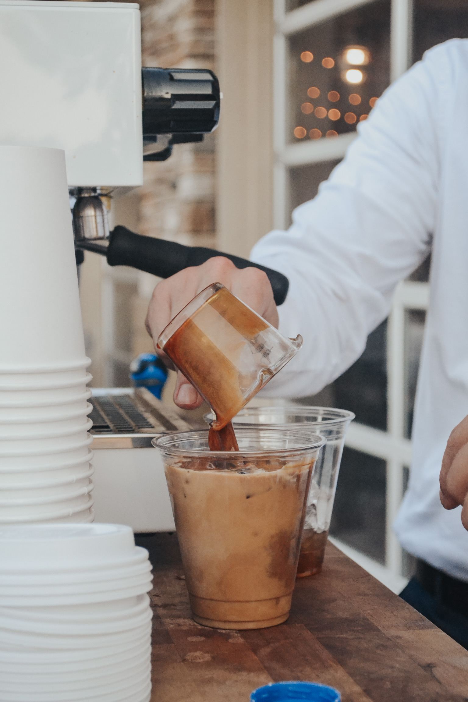Phase 2 Coffee Co. barista pouring espresso at Kansas City wedding