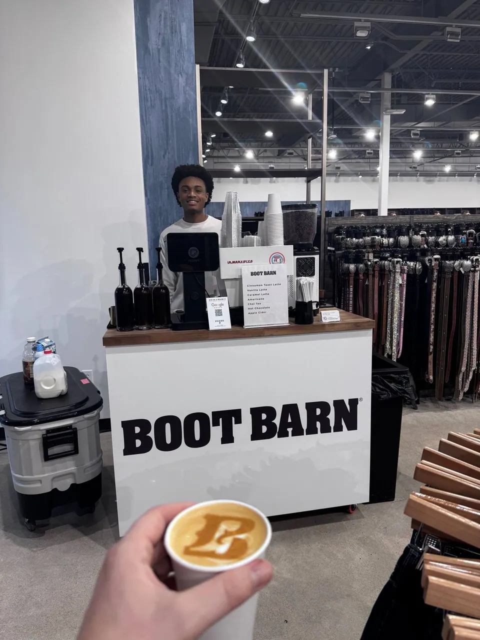 Phase 2 Coffee Co. barista serving at Boot Barn brand activation Kansas City