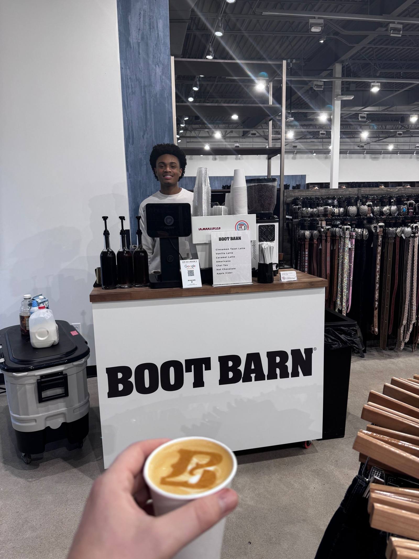 Phase 2 Coffee Co. barista serving at Boot Barn brand activation Kansas City