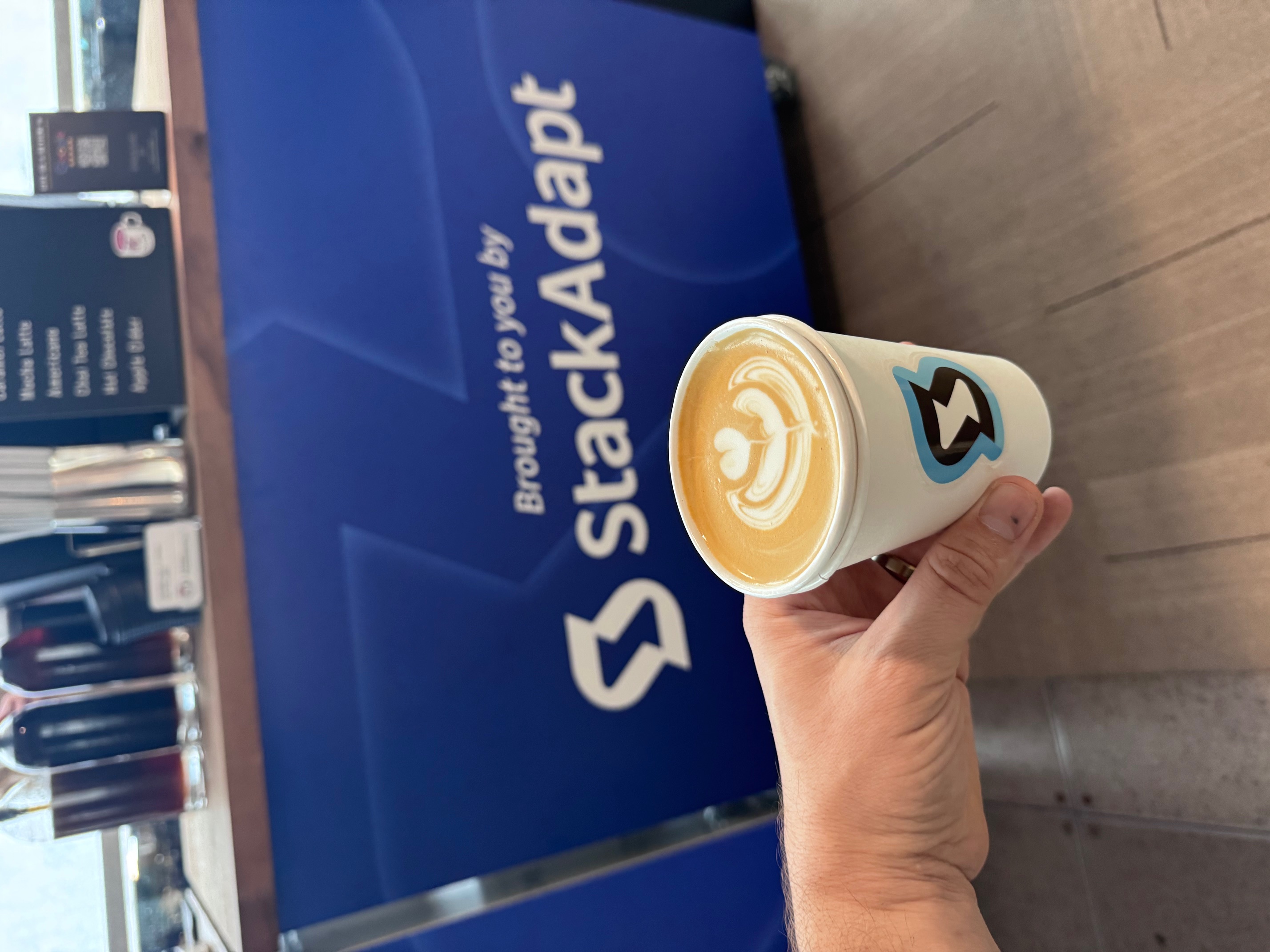 Phase 2 barista serving lattes at StackAdapt brand activation Kansas City